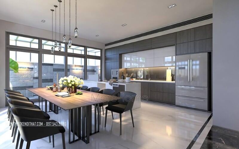 Bộ bàn ghế ăn, đèn thả, tủ bếp acrylic, laminate đã tạo nên vẻ đẹp sang trọng, độc đáo cho phòng ăn liền bếp. Thiết kế nội thất phòng ăn biệt thự